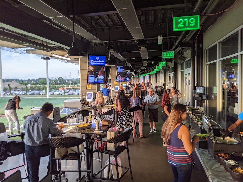 TopGolf outside golfing and eating